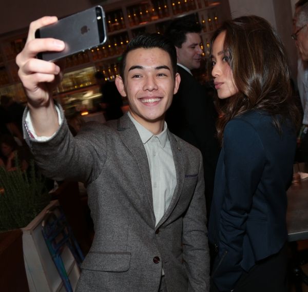 Ryan Potter and Jamie Chung pose for a photo as Disney celebrates their 2015 Golden G Photo