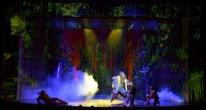 The Lion (Trevor Dion Nicholas, center) attacks when he first encounters the Scarecrow (David LaMarr), Dorothy (Destinee Rea) and the Tinman (Tyrick Wiltez Jones) @ BroadwayWorld The Lion (Trevor Dion Nicholas, center) attacks when he first encounters the Scarecro Photo