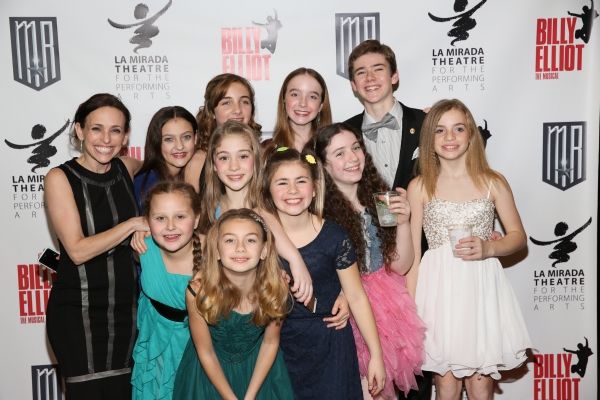 Choreographer Dana Solimando poses with the ensemble dancers Photo