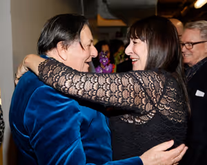 Dame Edna creator and performer Barry Humphries  celebrates with actress Anjelica Hus Photo