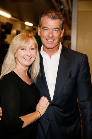 Wardrobe and makeup artist Leigh Evans and actor Pierce Brosnan  Photo