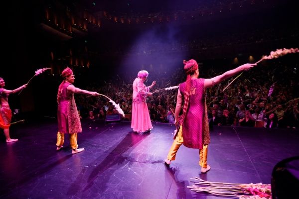 Dame Edna and the cast throw gladiolas to the audience Photo