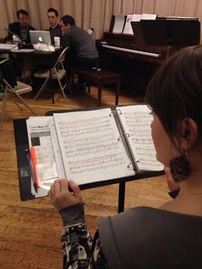 Kid Victoryâ€™s music team is busy at work as Laura Darrell looks on. Photo by J Photo