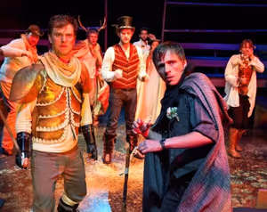 Front: Morgan Maher (Wilke) and John Henry Roberts (Hollow Thom Gadsden); Back: Christopher M. Walsh (Abraham), Brandon Ruiter (Casper), Cliff Chamberlain (Hap the Golden), Patrick Falcon (Ensemble), Paige Collins (Rienne) and Kara Davidson (Ensemble) in @ BroadwayWorld Front: Morgan Maher (Wilke) and John Henry Roberts (Hollow Thom Gadsden); Back: Chris Photo