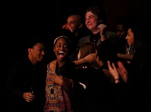 Center, Shaila Essley, 1st place winner hears her name called during the August Wilso Photo