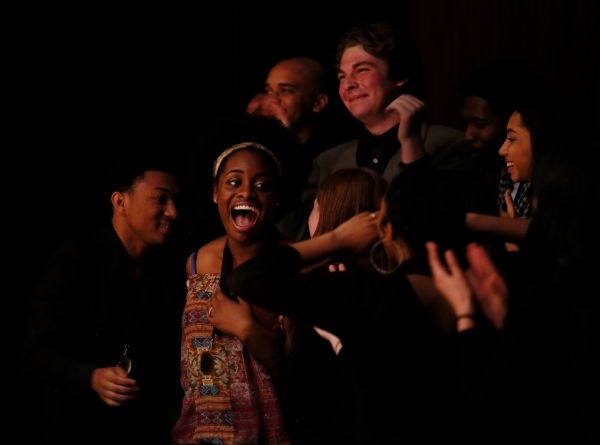 Center, Shaila Essley, 1st place winner hears her name called during the August Wilso Photo