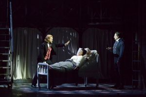 Valjean (Gregg Goodbrod), left, and Javert (Aoysius Gigl), right, argue in the hospital room of Fantine (Margaret Kelly) @ BroadwayWorld Valjean (Gregg Goodbrod), left, and Javert (Aoysius Gigl), right, argue in the hospit Photo