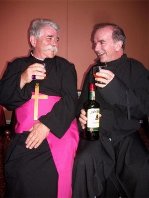 Archbishop Monticello (Rex Gray, left) and Father Costello (Noel O’Neill - also writer and director of the play) share a liquid blessing @ BroadwayWorld Archbishop Monticello (Rex Gray, left) and Father Costello (Noel O’Neill - als Photo