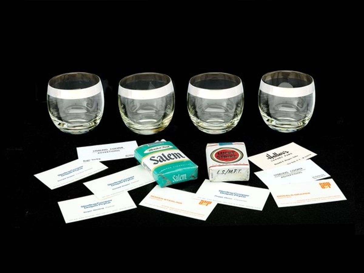 Glasses from Don Draper''s bar cart with Draper''s business cards and Lucky Strikes (National Museum of American History) at 