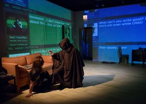 Michelle (Cristiana Barbatelli) falls victim to a hooded FIC assassin (Chris Fowler). @ BroadwayWorld Michelle (Cristiana Barbatelli) falls victim to a hooded FIC assassin (Chris Fowler). Photo