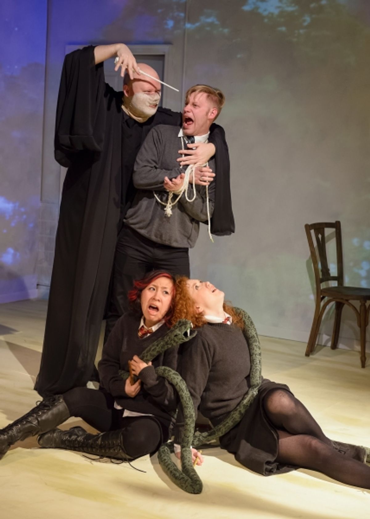 Within the HARRY POTTER badfic, Lord Voldemort holds Draco hostage (standing l to r - David Flora and Jake Szczepaniak) as his snake Nagini ensnares Ron and Hermione (seated l to r - Stephanie Shum and Katie Hunter). at 