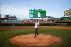 THE BOOK OF MORMON star David Larsen (Elder Price) throws out the Chicago Cubs Ceremo Photo