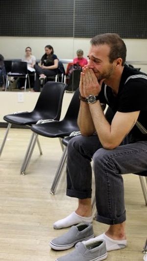 Mark Eric Gomez (Tom) rehearses a scene from NEAT & TIDY Photo