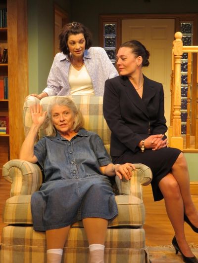 Marnie Andrews (seated), Corey Tazmania (dark suit), Dana Benningfield (standing behi Photo