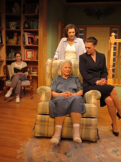 Marnie Andrews (seated), Corey Tazmania (dark suit), Dana Benningfield (standing behi Photo