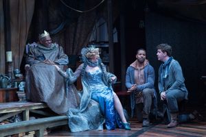 Claudius (Craig Wallace) and Gertrude (Kimberly Schraf) share a laugh with a bewildered Rosencrantz (Romell Witherspoon) and Guildenstern (Adam Wesley Brown, far right). @ BroadwayWorld Claudius (Craig Wallace) and Gertrude (Kimberly Schraf) share a laugh with a bewilder Photo