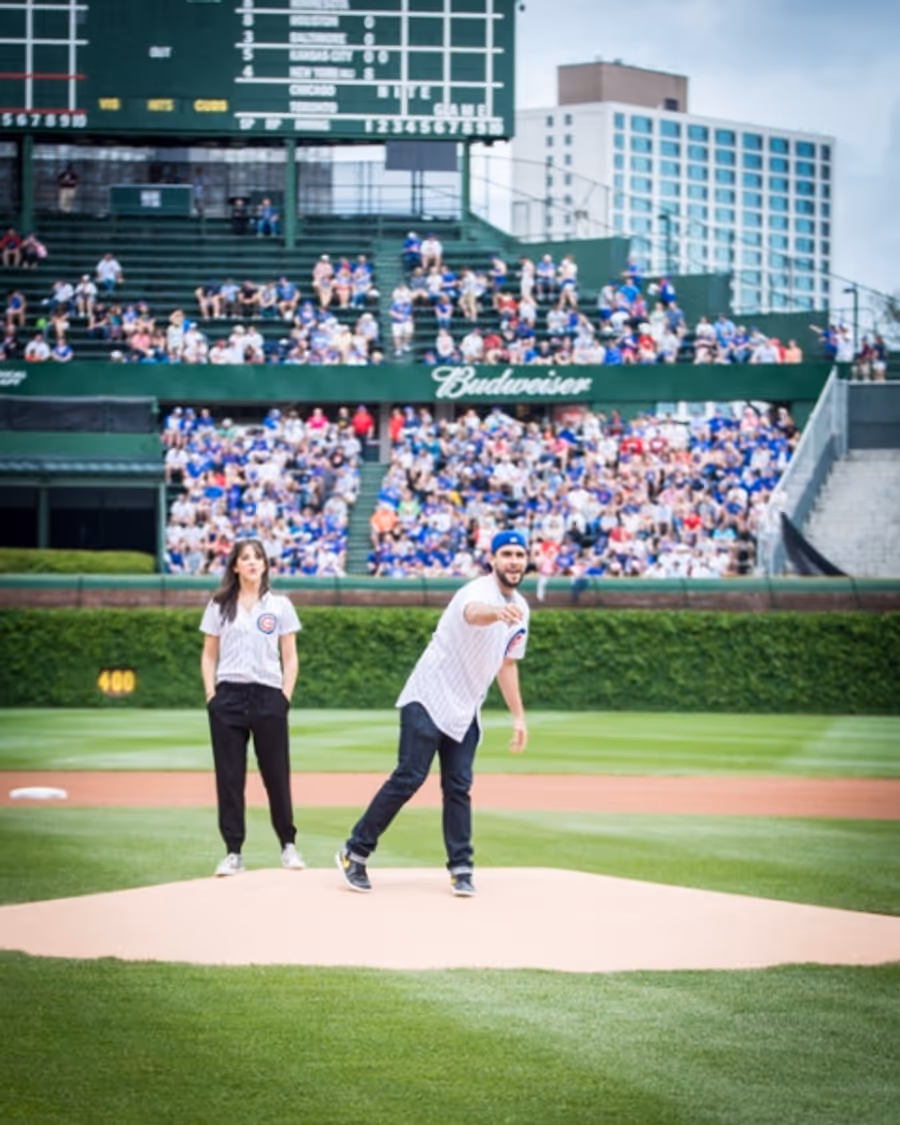 Exclusive Photo Coverage: ON YOUR FEET Stars Ana Villafañe and Josh Segarra Throw Out First Pitch at Chicago Cubs Game Image