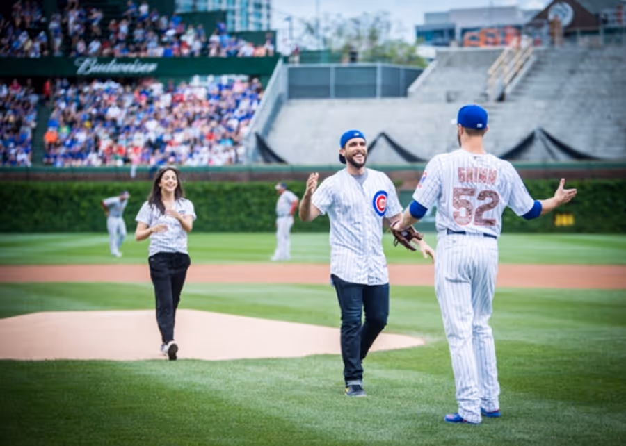 Exclusive Photo Coverage: ON YOUR FEET Stars Ana Villafañe and Josh Segarra Throw Out First Pitch at Chicago Cubs Game Image