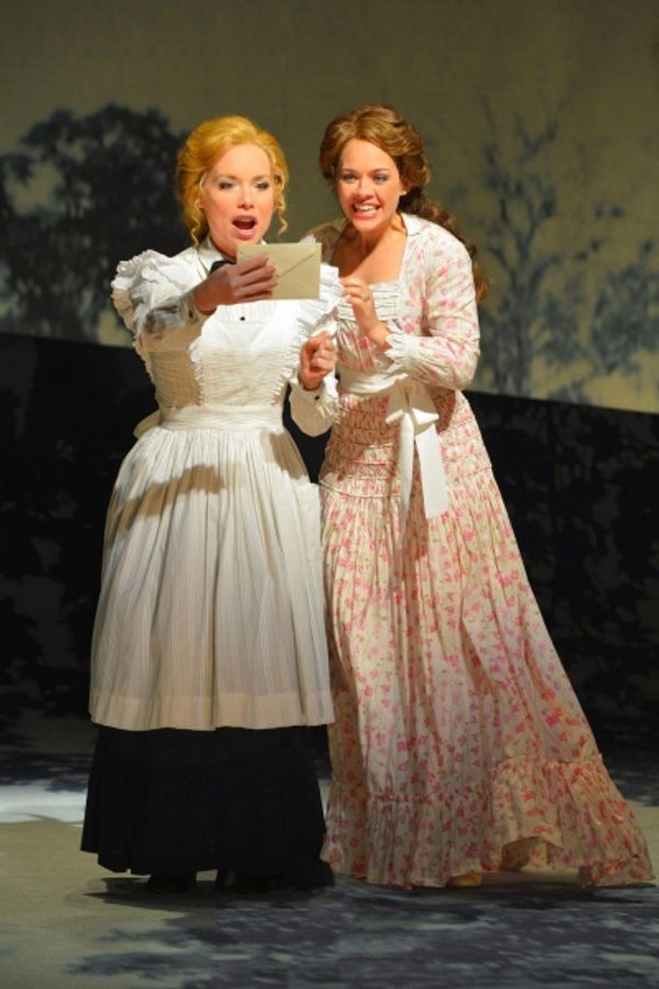 Petra (Marissa McGowan) and Anne Egerman (Laurie Veldheer) receive an invitation to a Photo