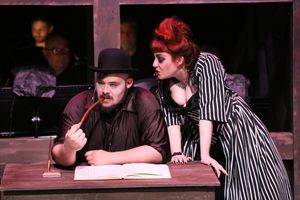 Mr. Peachum (Zachary Allen Farmer) and Mrs. Peachum (Sarah Porter) make plans Photo