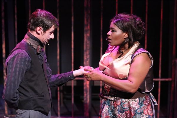 Macheath (Todd Schaefer) gets his palm read by Jenny (Nikki Glenn) Photo