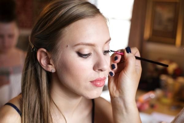 Molly Coleman of Wild Party gets her makeup done by Khaki Pixley.  Photo