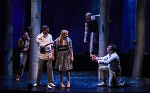 Puck (Nick Cearley) and Oberon (Andrew Guilarte) observe the Athenians, Lysander (Rey Photo