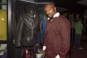 ''The Have and Have Nots'' star, Jerome Ro Brooks, poses next to Al Pacino''s leather jacket from ''Cruising.'' @ BroadwayWorld ''The Have and Have Nots'' star, Jerome Ro Brooks, poses next to Al Pacino''s leather Photo