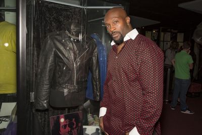 ''The Have and Have Nots'' star, Jerome Ro Brooks, poses next to Al Pacino''s leather Photo