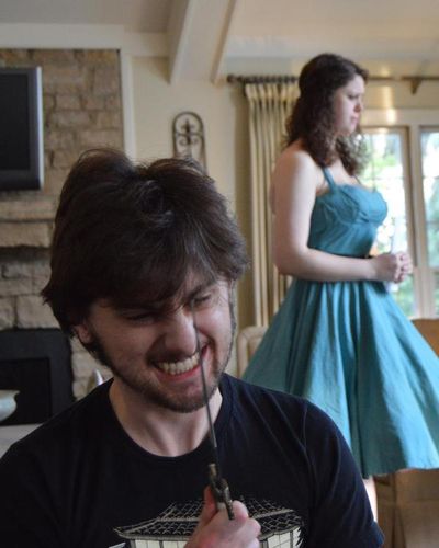 Jack Miller (Hamlet) and Rachel Marschner (Ophelia) waits, rehearsing the Act III sol Photo