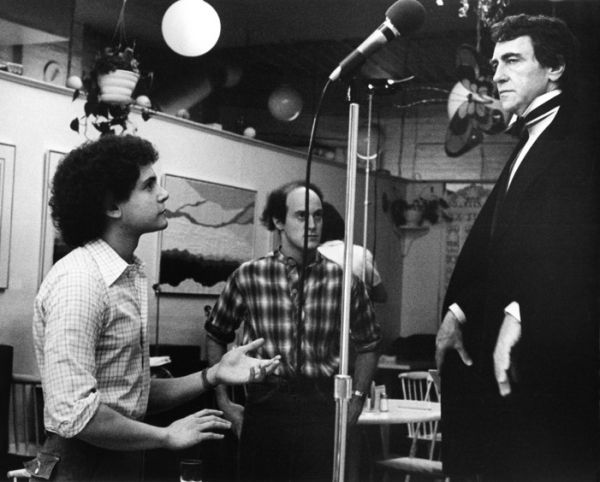 Neil Meron looks on as Craig Zadan directs Joseph Papp in his singing debut at the Ba Photo