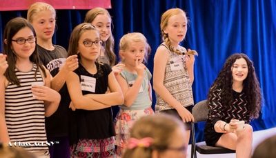 Lilla Crawford leading A Class Act NY students in an improv game. Photo