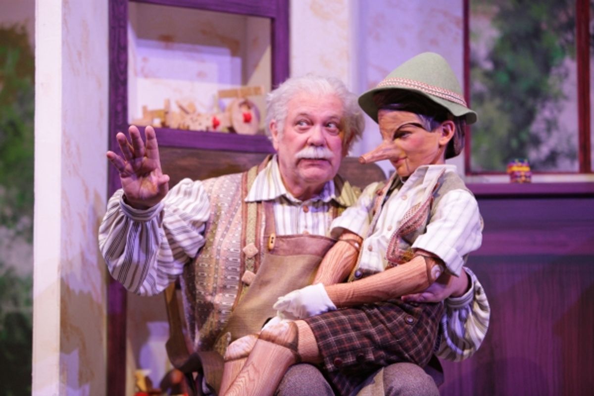 Geppetto (Nicholas F. Saverine) gets to know his new son Pinocchio (Topher Cundith). at 