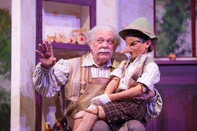 Geppetto (Nicholas F. Saverine) gets to know his new son Pinocchio (Topher Cundith). Photo