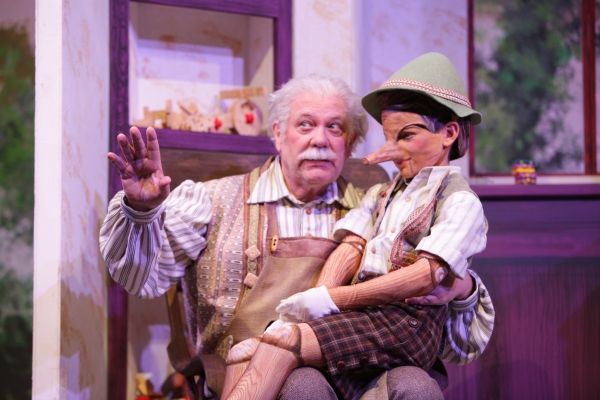 Geppetto (Nicholas F. Saverine) gets to know his new son Pinocchio (Topher Cundith). Photo