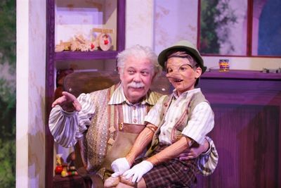 Geppetto (Nicholas F. Saverine) gets to know his new son Pinocchio (Topher Cundith). Photo