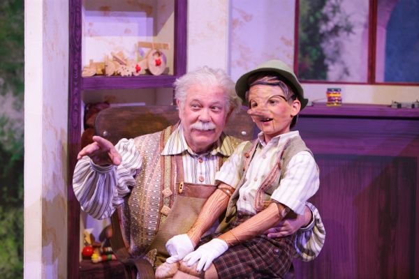 Geppetto (Nicholas F. Saverine) gets to know his new son Pinocchio (Topher Cundith). Photo