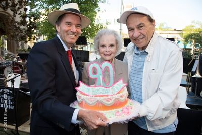 June Lockhart receives birthday cake from conductor Gary Greene (left), and two-time  Photo