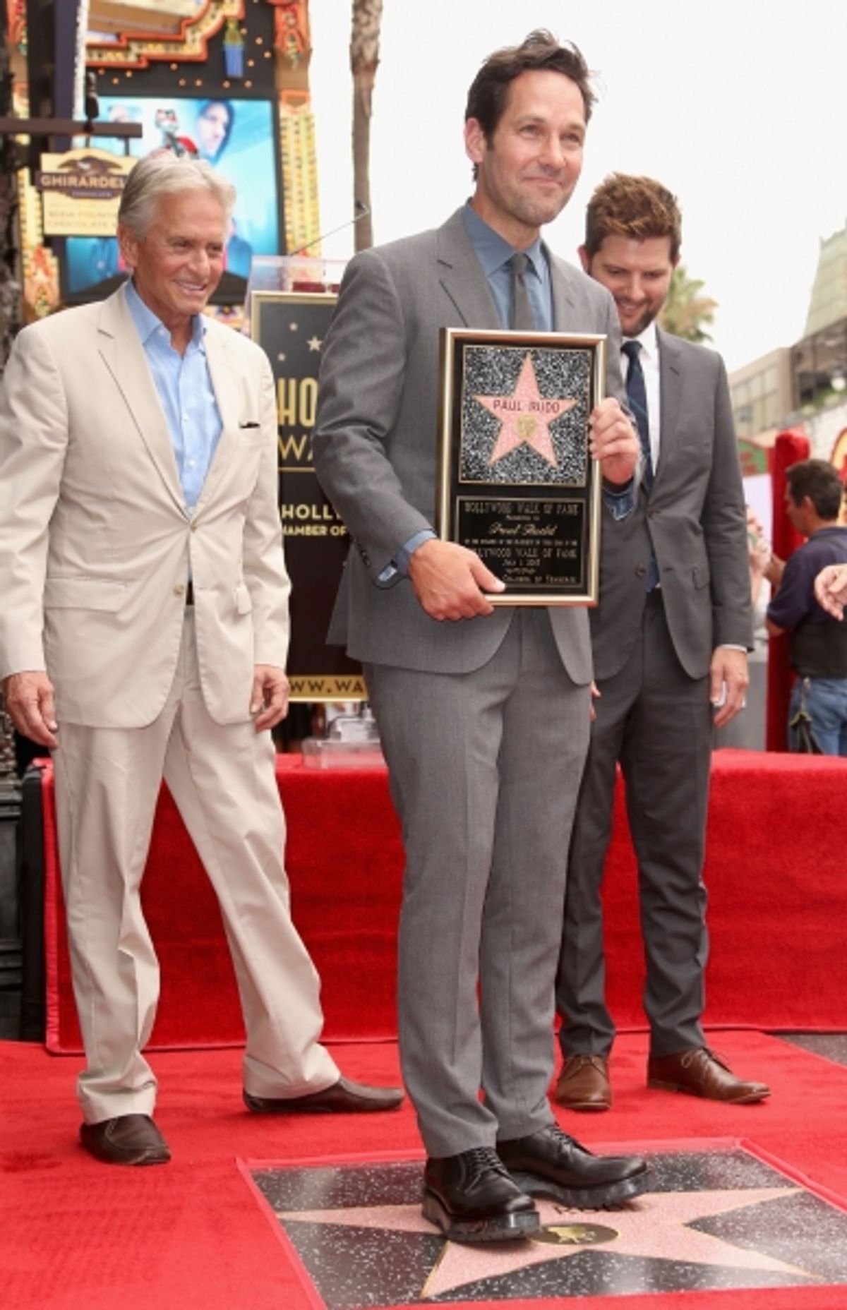 Paul Rudd poses with actors Michael Douglas and Adam Scott at 