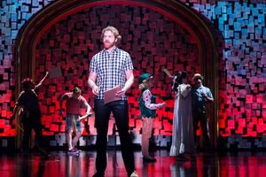 Travis Taylor (John) and the ensemble Photo