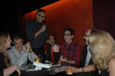Host Ben Cameron (standing) at the special NYMF Sneak Peak edition of BROADWAY SESSIO Photo