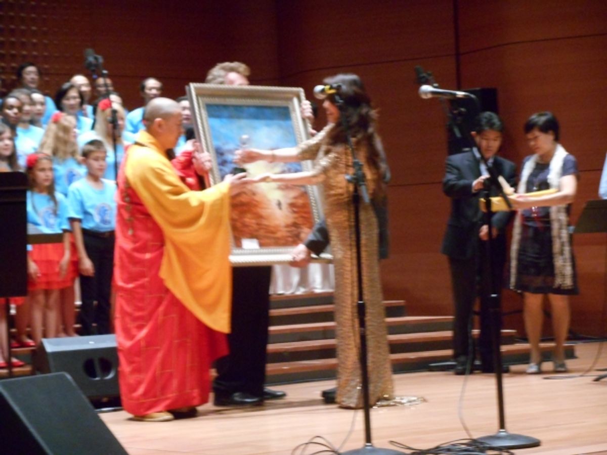 Ms. Alice Liu, president of the American Oriental Arts Foundation exchanging gifts at 
