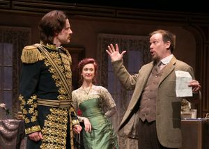 The Debt Collector (Sheffield Chastain) sees through The Actorâ€s (Jon Barker) ruse as The Actress (Victoria Mack) looks on. @ BroadwayWorld The Debt Collector (Sheffield Chastain) sees through The Actorâ€s (Jon Barker) rus Photo