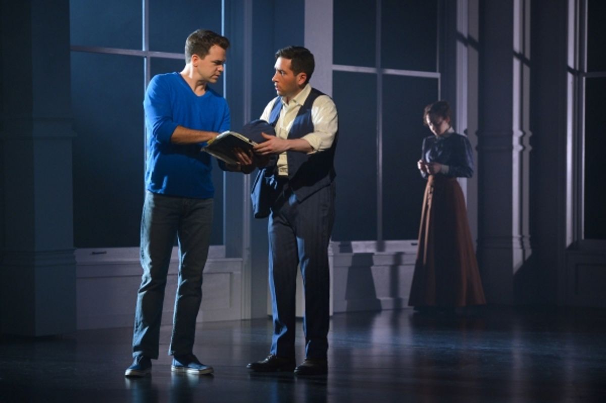 Brian (Ross Lekites) explains the connection they share with the Triangle Shirtwaist Factory to Ben (Zachary Prince) as a vision of Sarah (Megan McGinnis) lingers in the background  at 