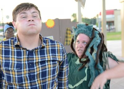 Wiley (Stebert Davenport) holds his ground against the Hairy Man (Mandy Logsdon) Photo