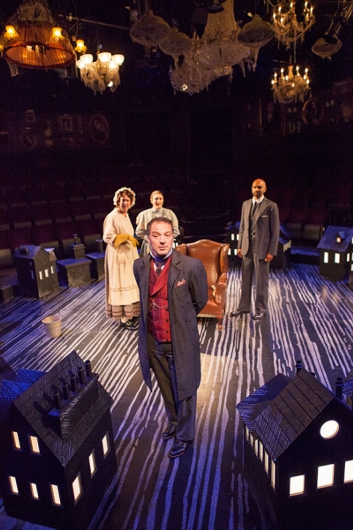 Euan Morton as Sherlock Holmes (foreground) with (from left) Andrew Kober as Daisy, Liz Wisan as Mrs. Hudson, and Usamn Ally as Doctor Watson at 