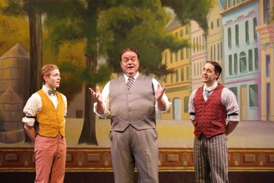 Horace Vandergelder (Bill Nolte) explains his view of the fairer sex to his clerks Ba Photo