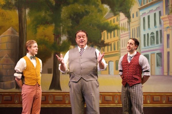 Horace Vandergelder (Bill Nolte) explains his view of the fairer sex to his clerks Ba Photo