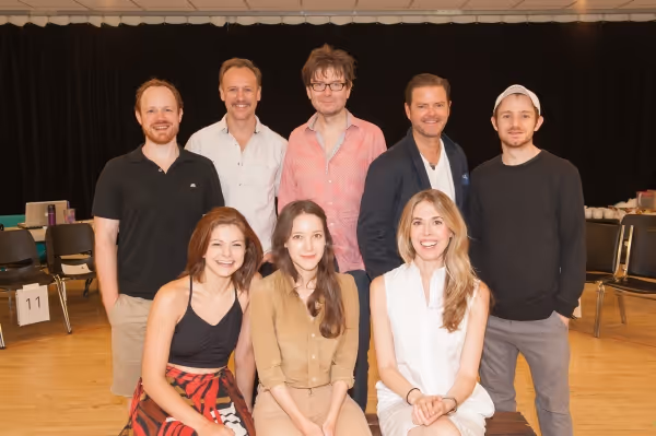 Front row: Izzie Steele, Brooke Bloom, Lucy Owen. Standing: Sean Dugan, John Sanders, Photo