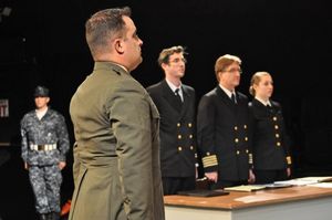 Foreground: TOM PHIEL (Jasper). Background (L to R): JACOB TICE (Kaffee), JIM ROGERS (Sam) and CASSIE JO FASTABEND (Jo) from the Lakewood Playhouse Production of ''A FEW GOOD MEN'' @ BroadwayWorld Foreground: TOM PHIEL (Jasper). Background (L to R): JACOB TICE (Kaffee), JIM ROGER Photo
